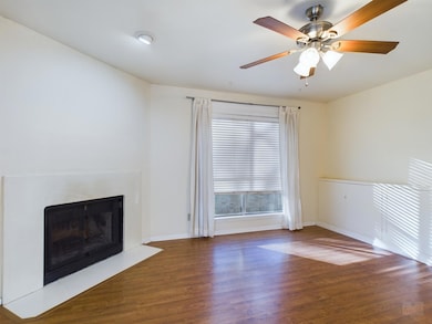 Unfurnished living room with ceiling fan, baseboa