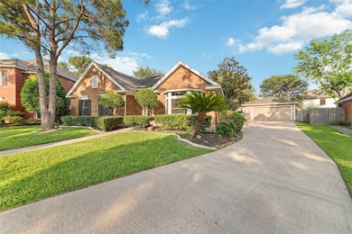 Charming brick home with a manicured front yard, f