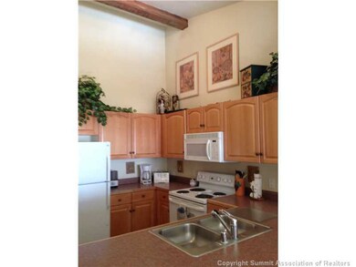 Kitchen. Dramatic high ceilings make a dramatic st