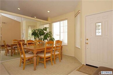 Formal dining area with mirrored wall