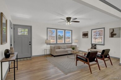 Living room featuring natural light, hardwood floo