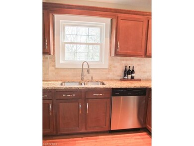 Kitchen has tile backsplash.