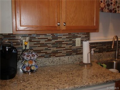 Granite counter top with mosaic glass tile back sp