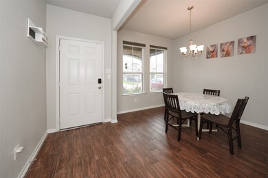 This is a cozy dining area with wood-style floorin