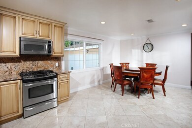 The chef in the family is going to truly appreciate the expansive remodeled kitchen with its sparkling picture window,  recessed lighting, newer modern antique finished cabinetry, pantry, dual basin undermount  sink with pull-down faucet, granite cou