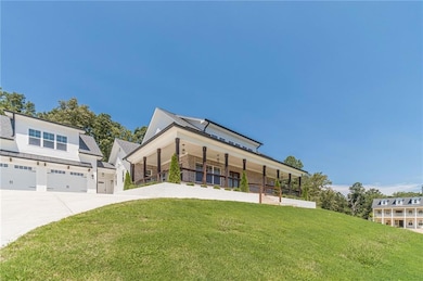 View of building exterior with concrete driveway and a garage