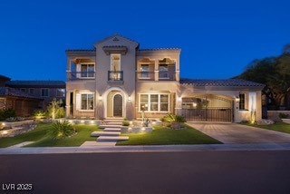 Mediterranean / spanish-style house featuring a ba