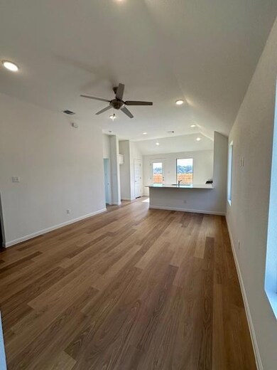 Unfurnished living room with wood finished floors