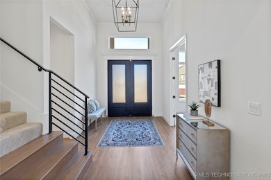 Foyer and wrought iron stair railing.