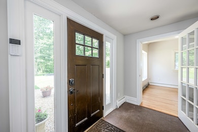 Entry foyer with copper tile diamond plate flooring.