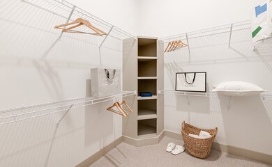 Walk in closet with full size w/d not shown.