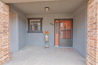 Very nice covered front porch~ Relax and watch the world go by, and stay out of the weather at the same time!