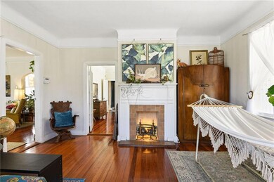 Living room; gas fireplace is capped off.