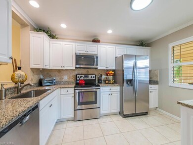 Kitchen, crown molding, plantation shutters, granite counters, stainless appliances