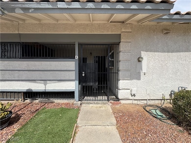 Property entrance with stucco siding