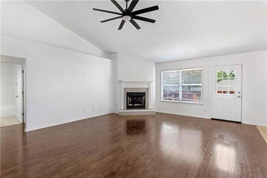 Unfurnished living room with a textured ceiling, c