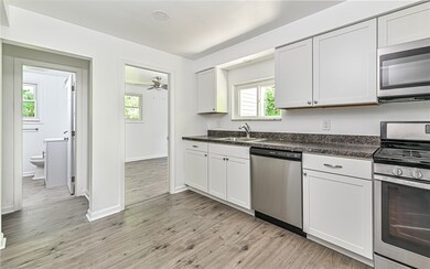 Stainless steel appliances with gas stove, over th