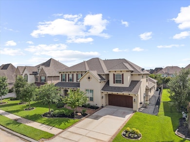 Aerial view of the front gorgeous stucco home
