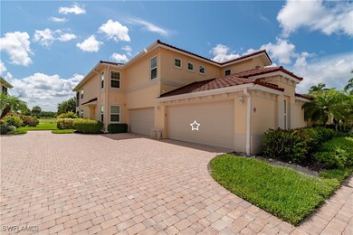 View of side of home with stucco siding, a tiled r