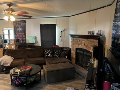 Living area with a decorative wall, wood finished