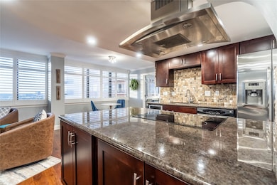 Granite countertops and stainless-steel appliances.