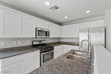 Kitchen featuring appliances with stainless steel