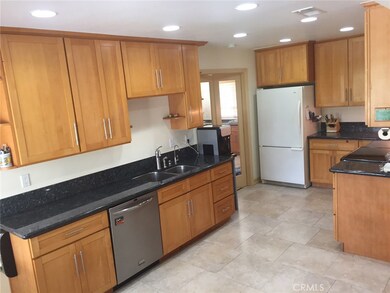 Kitchen: black pearl granite, 18 x 18 Italian ceramic tile, birch wood cabinets, recessed lighting