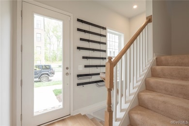Foyer entrance featuring baseboards, recessed ligh