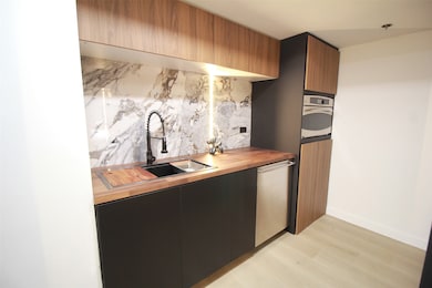 A chef’s dream kitchen featuring a warm, durable butcher block countertop