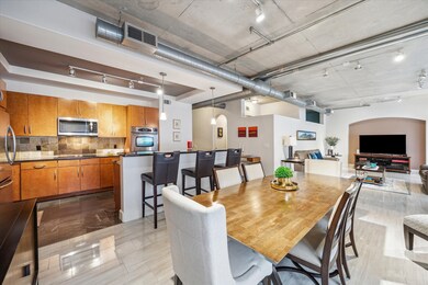 Modern kitchen and dining area featuring warm wood