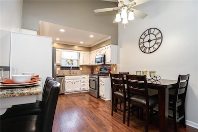 Kitchen w/ bar top seating and room for your table