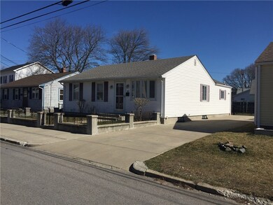 Front of property showing cement driveway