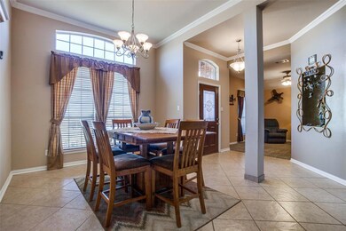 Walking through the front door into formal dinning and office.