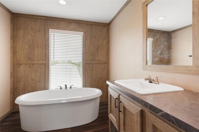 Bathroom featuring recessed lighting, a freestand