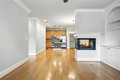 Unfurnished living room with a multi sided fireplace, light wood-type flooring, ornamental molding, and recessed lighting