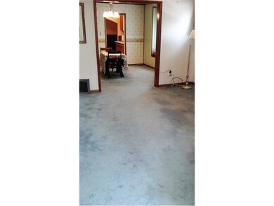 The living room flows right into the lovely dining