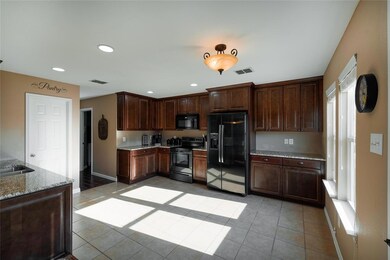 New cabinets, granite and upgraded appliances in t