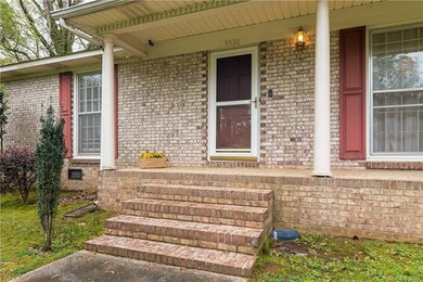 Brick front with a rocking chair front porch