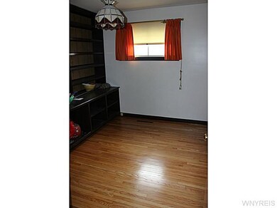 Bedroom. Built-in book shelves add extra storage.