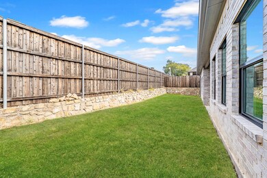 View of fenced backyard