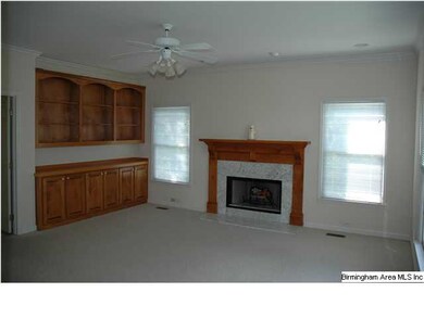 Great room with wood buring fireplace and built in