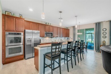 Open kitchen with Kitchen Aid stainless appliances