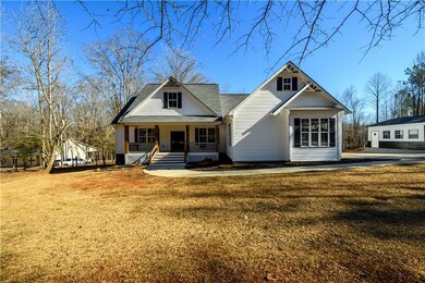 View of front of home with a front yard and a porch