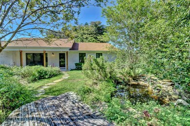 Front of the house with butterfly garden and sitti