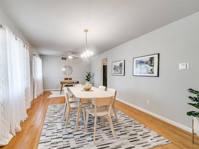 Dining space featuring light wood-style floors and ceiling fan