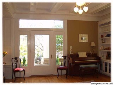 Spacious Parlor with coffered ceilings and built-i