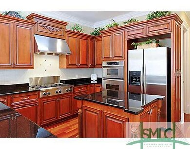 Kitchen. Notice the stainless hood, side by side r