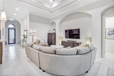 Living room featuring a towering ceiling and light