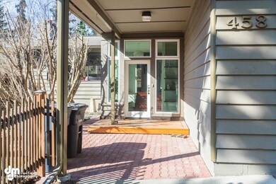 Covered entry with oversized windows