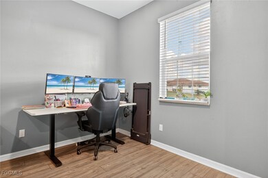 Office space featuring baseboards and light wood-style floors